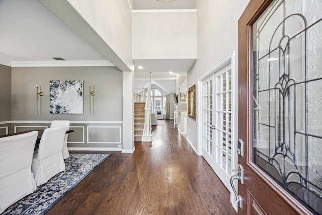 3805 Blaylock Pl, Plano, TX 75025 - entryway featuring wood finished floors, stairs, french doors, a decorative wall, and a wainscoted wall