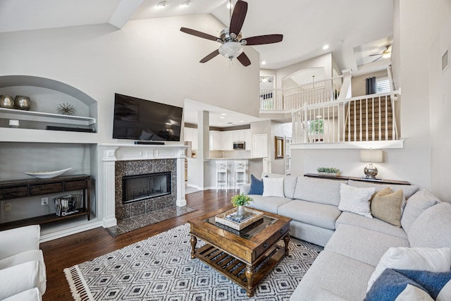 3805 Blaylock Pl, Plano, TX 75025 - living room featuring ceiling fan, dark wood finished floors, a premium fireplace, and high vaulted ceiling