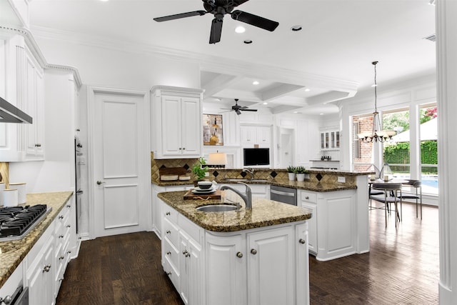 3928 Dove Creek Ln, Plano, TX 75093 - kitchen with a ceiling fan, appliances with stainless steel finishes, a peninsula, beamed ceiling, and backsplash