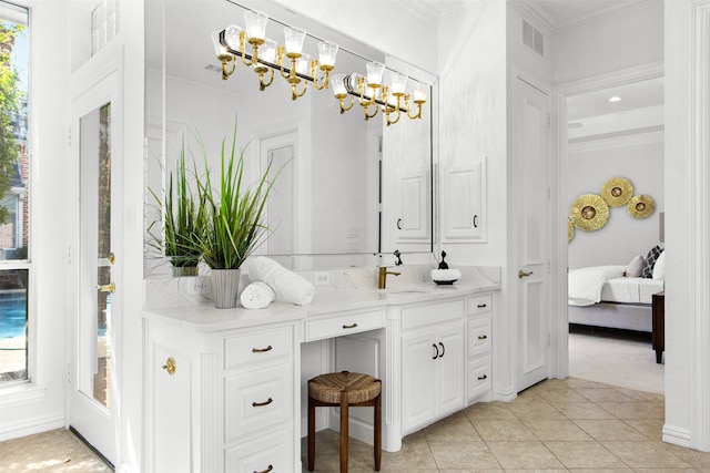 3928 Dove Creek Ln, Plano, TX 75093 - ensuite bathroom with double vanity, a chandelier, plenty of natural light, ornamental molding, and tile patterned floors