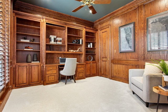 3928 Dove Creek Ln, Plano, TX 75093 - carpeted office featuring built in study area, wooden walls, a ceiling fan, and ornamental molding