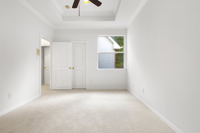 3928 Dove Creek Ln, Plano, TX 75093 - unfurnished bedroom featuring a raised ceiling, crown molding, light colored carpet, and a ceiling fan