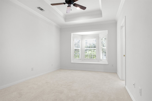 3928 Dove Creek Ln, Plano, TX 75093 - empty room featuring a ceiling fan, light colored carpet, ornamental molding, and a raised ceiling