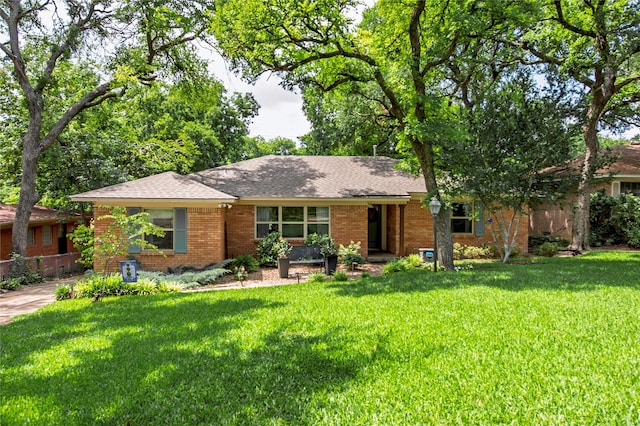 8803 Westglen Dr, Dallas, TX 75228 - ranch-style house featuring a front yard, brick siding, and a shingled roof