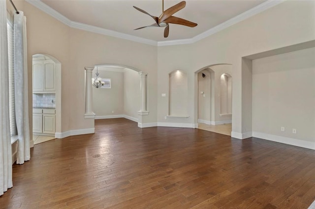 3804 Park Flower Ct, Arlington, TX 76017 - spare room with a ceiling fan, arched walkways, ornamental molding, hardwood / wood-style floors, and decorative columns