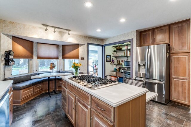 5715 Northaven Rd, Dallas, TX 75230 - kitchen with appliances with stainless steel finishes, plenty of natural light, a center island, light countertops, and recessed lighting