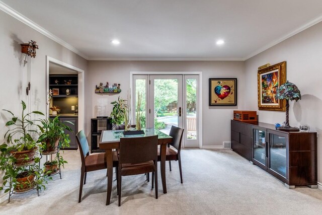 5715 Northaven Rd, Dallas, TX 75230 - dining room featuring light carpet, ornamental molding, and recessed lighting