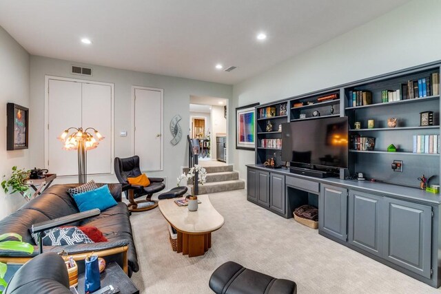 5715 Northaven Rd, Dallas, TX 75230 - living room featuring light carpet, recessed lighting, and stairway