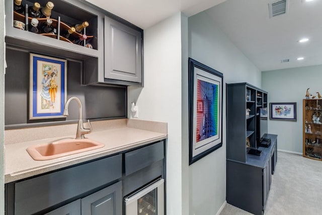 5715 Northaven Rd, Dallas, TX 75230 - kitchen featuring gray cabinets, light colored carpet, light countertops, recessed lighting, and beverage cooler