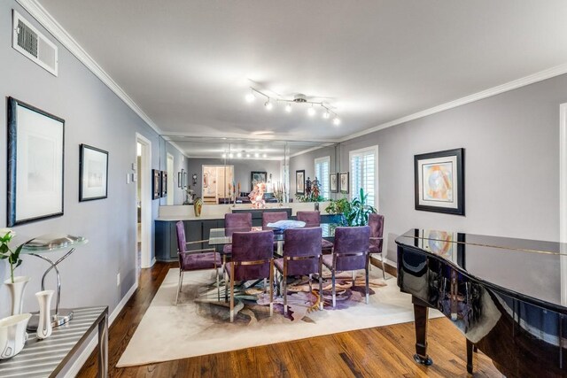 5715 Northaven Rd, Dallas, TX 75230 - dining space with dark wood finished floors and ornamental molding