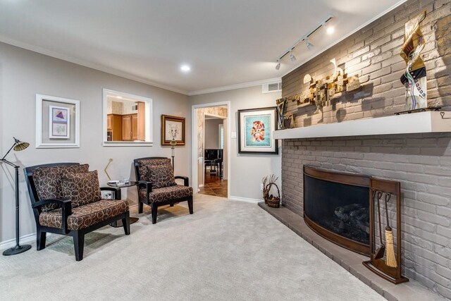 5715 Northaven Rd, Dallas, TX 75230 - living area with carpet, crown molding, a fireplace, and track lighting
