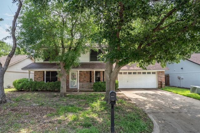 2214 Parkside Dr, Denton, TX 76201 - view of front of property featuring brick siding, driveway, a porch, and an attached garage