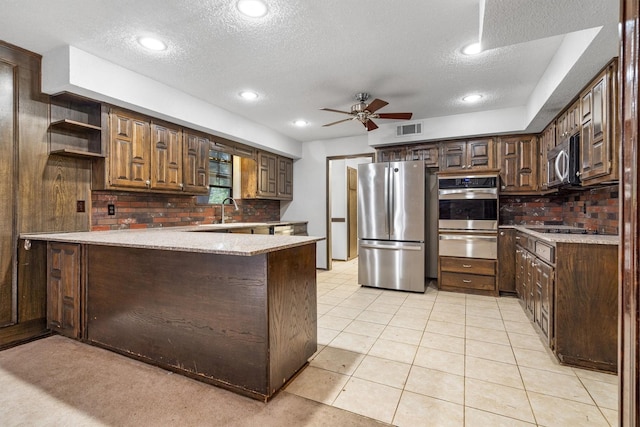 2214 Parkside Dr, Denton, TX 76201 - kitchen featuring stainless steel appliances, a warming drawer, a peninsula, open shelves, and ceiling fan