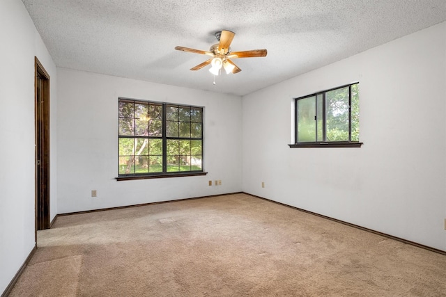 2214 Parkside Dr, Denton, TX 76201 - carpeted spare room featuring ceiling fan and a textured ceiling