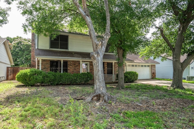 2214 Parkside Dr, Denton, TX 76201 - traditional-style home with a garage, concrete driveway, and brick siding