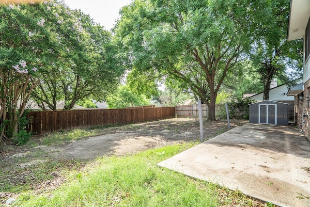 2214 Parkside Dr, Denton, TX 76201 - fenced backyard with a storage unit