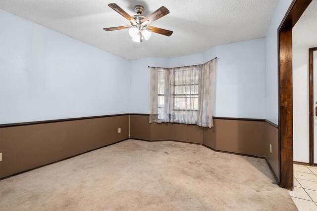 2214 Parkside Dr, Denton, TX 76201 - carpeted empty room with ceiling fan and a textured ceiling