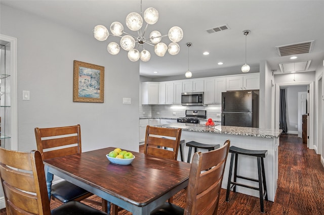 2711 El Tivoli Dr, Dallas, TX 75211 - dining area featuring attic access, dark wood-type flooring, and recessed lighting