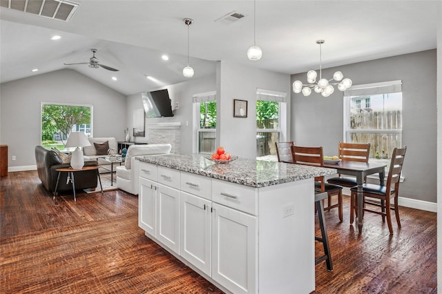 2711 El Tivoli Dr, Dallas, TX 75211 - kitchen featuring dark wood-type flooring, a ceiling fan, a center island, white cabinetry, and lofted ceiling
