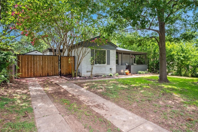 2711 El Tivoli Dr, Dallas, TX 75211 - view of front of house with brick siding