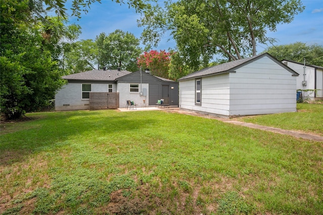 2711 El Tivoli Dr, Dallas, TX 75211 - rear view of house featuring a patio area, a yard, and a shingled roof