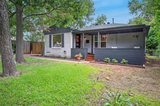 2711 El Tivoli Dr, Dallas, TX 75211 - view of front facade featuring brick siding and covered porch