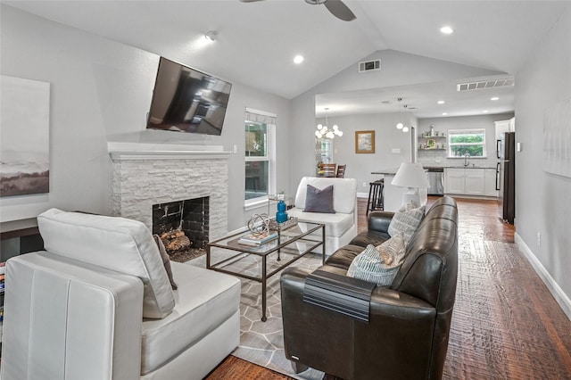 2711 El Tivoli Dr, Dallas, TX 75211 - living room featuring a ceiling fan, lofted ceiling, wood finished floors, a fireplace, and recessed lighting