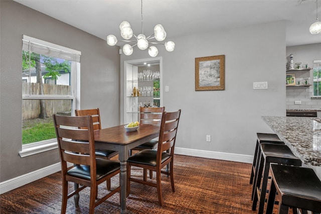 2711 El Tivoli Dr, Dallas, TX 75211 - dining area with baseboards and a chandelier