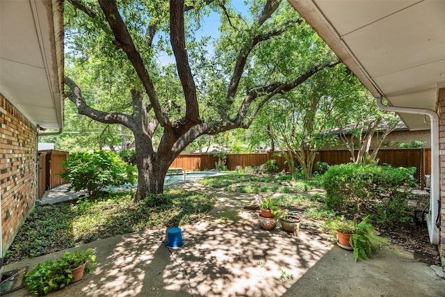 13861 Far Hills Ln, Dallas, TX 75240 - fenced backyard with a patio area