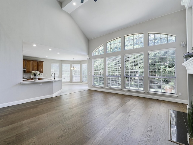 925 Canongate Dr, Flower Mound, TX 75022 - unfurnished living room with high vaulted ceiling, dark wood-type flooring, and recessed lighting