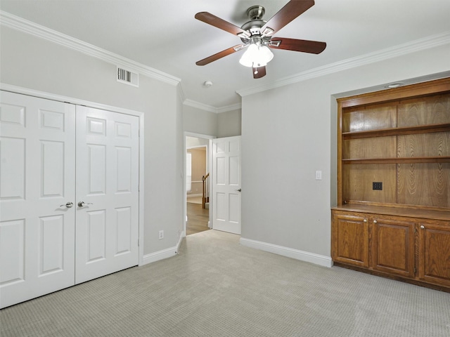 925 Canongate Dr, Flower Mound, TX 75022 - unfurnished bedroom featuring light carpet, ornamental molding, a closet, and a ceiling fan
