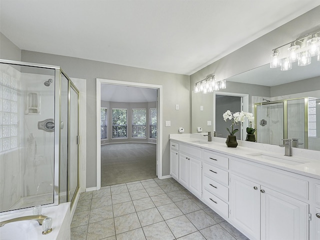 925 Canongate Dr, Flower Mound, TX 75022 - bathroom with double vanity, a shower stall, and tile patterned floors