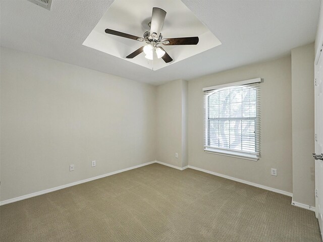 925 Canongate Dr, Flower Mound, TX 75022 - carpeted empty room with a raised ceiling and ceiling fan