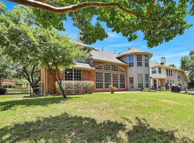 925 Canongate Dr, Flower Mound, TX 75022 - rear view of house featuring brick siding, a chimney, and roof with shingles