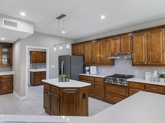 925 Canongate Dr, Flower Mound, TX 75022 - kitchen with appliances with stainless steel finishes, ventilation hood, light tile patterned flooring, light countertops, and recessed lighting