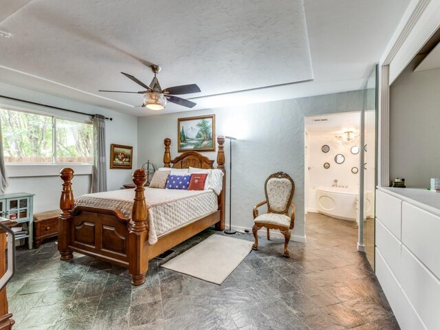 405 Chandler Lake Rd, Fort Worth, TX 76103 - bedroom with dark stone finish floors, ceiling fan, and a textured ceiling
