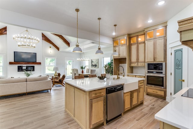 3020 Pueblo Trl, Lake Worth, TX 76135 - kitchen with black appliances, recessed lighting, light wood-style floors, light countertops, and an island with sink