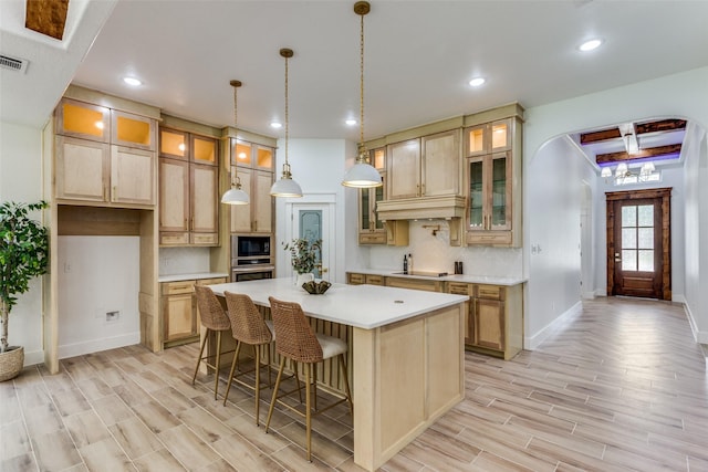 3020 Pueblo Trl, Lake Worth, TX 76135 - kitchen with black appliances, light wood finished floors, a kitchen island, tasteful backsplash, and light countertops