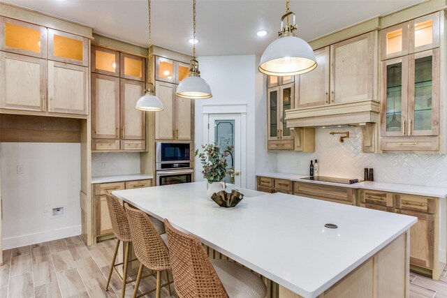 3020 Pueblo Trl, Lake Worth, TX 76135 - kitchen featuring black appliances, a kitchen island, backsplash, light countertops, and hanging light fixtures