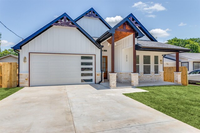 3020 Pueblo Trl, Lake Worth, TX 76135 - view of front of house with board and batten siding, stone siding, driveway, and an attached garage