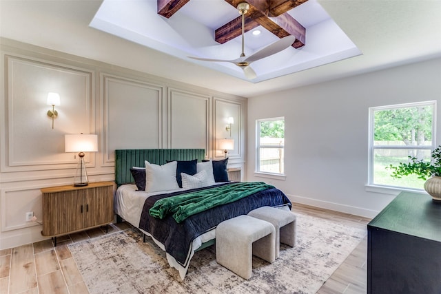 3020 Pueblo Trl, Lake Worth, TX 76135 - bedroom with light wood finished floors, beam ceiling, a ceiling fan, and coffered ceiling