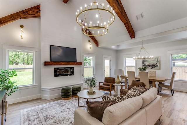 3020 Pueblo Trl, Lake Worth, TX 76135 - living room featuring a chandelier, beamed ceiling, light wood-style flooring, and high vaulted ceiling