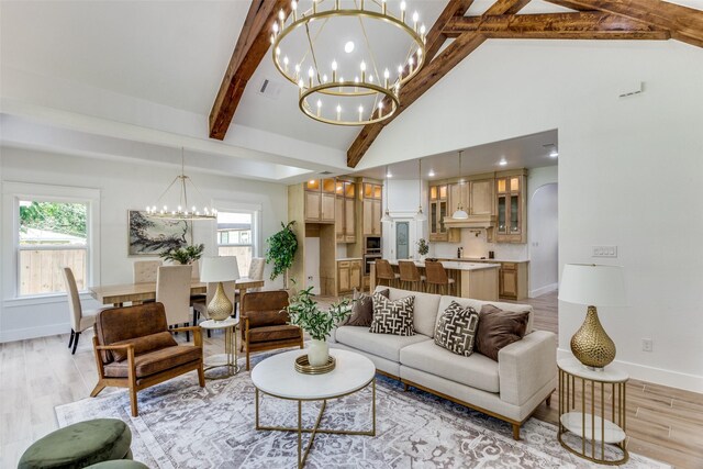 3020 Pueblo Trl, Lake Worth, TX 76135 - living room with a chandelier, light wood finished floors, beam ceiling, healthy amount of natural light, and high vaulted ceiling
