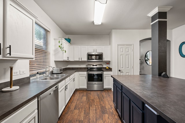 13341 Ridgepointe Rd, Fort Worth, TX 76244 - kitchen with stainless steel appliances, dark countertops, white cabinets, and dark wood-style flooring