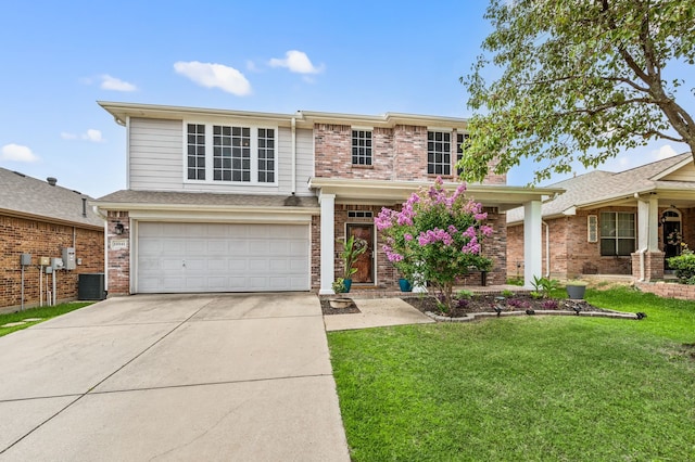 13341 Ridgepointe Rd, Fort Worth, TX 76244 - view of front facade with a front yard, driveway, a garage, and brick siding