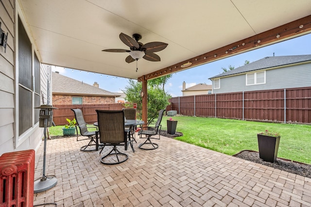 13341 Ridgepointe Rd, Fort Worth, TX 76244 - fenced backyard with a patio, a ceiling fan, and outdoor dining area