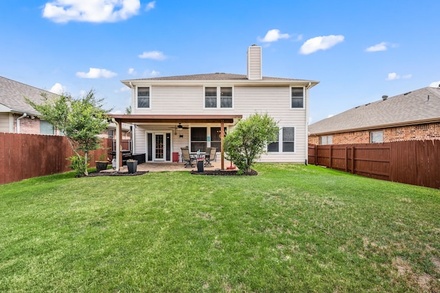 13341 Ridgepointe Rd, Fort Worth, TX 76244 - rear view of house featuring a ceiling fan, a chimney, a fenced backyard, and a patio area