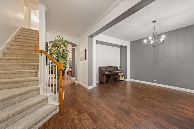 13341 Ridgepointe Rd, Fort Worth, TX 76244 - foyer entrance featuring arched walkways, wood finished floors, stairs, a chandelier, and crown molding