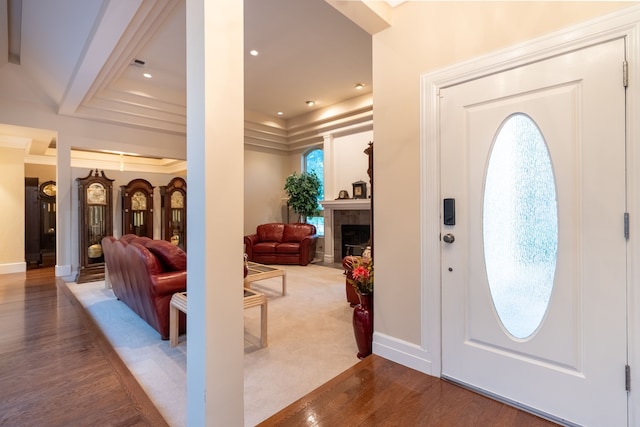 1450 Meandering Way, Rockwall, TX 75087 - entrance foyer with a fireplace, wood finished floors, and plenty of natural light