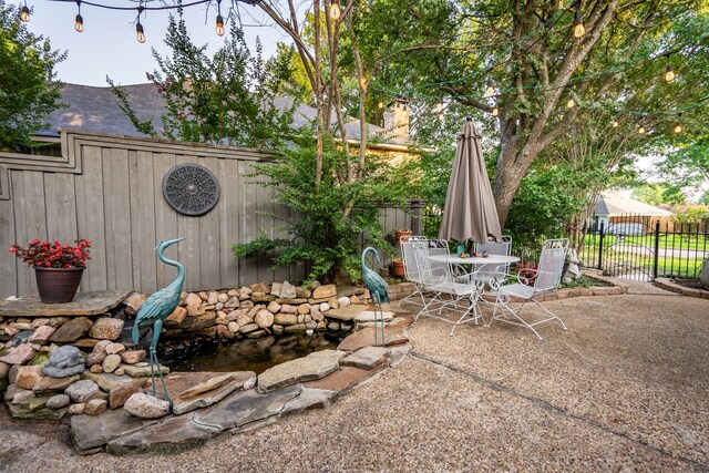 1450 Meandering Way, Rockwall, TX 75087 - view of patio / terrace featuring outdoor dining space